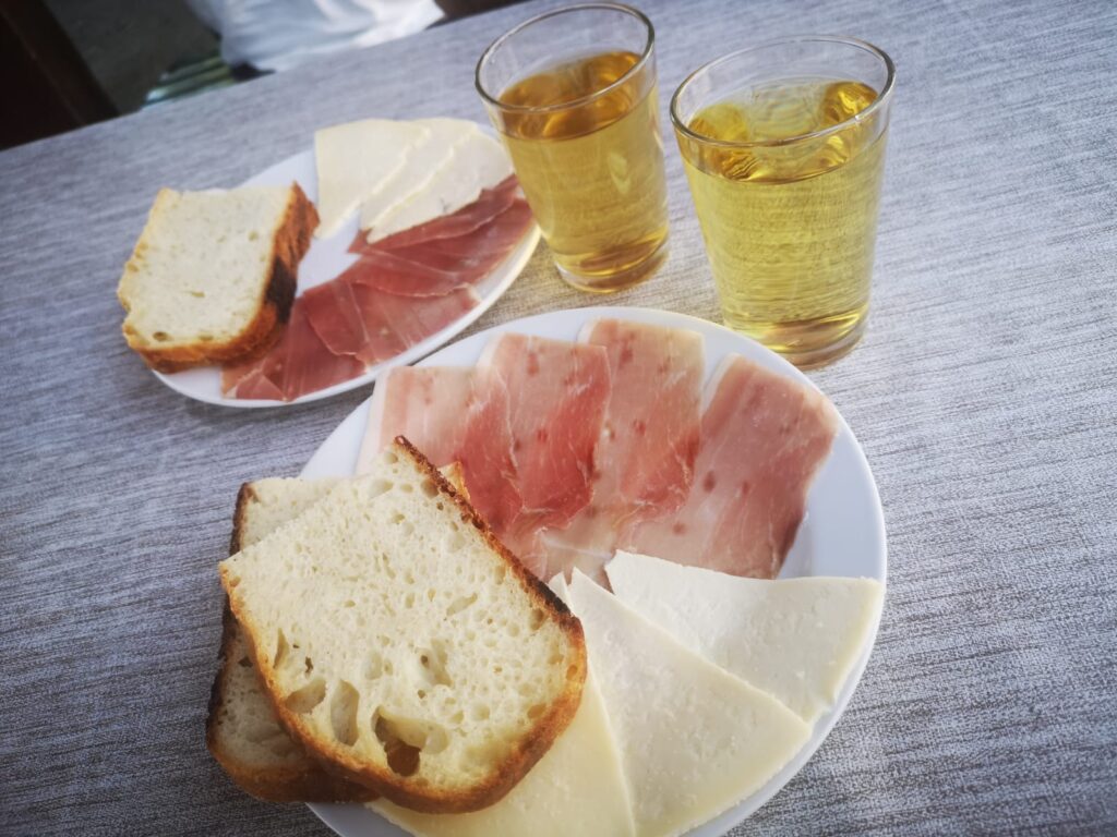 Montenegro local food: cheese, wine, bread, pršut.
