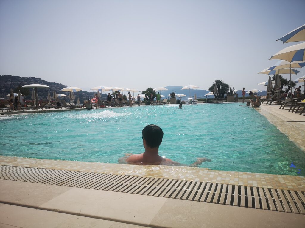 The Palmon Bay Hotel's Beach Club pool and outside area.