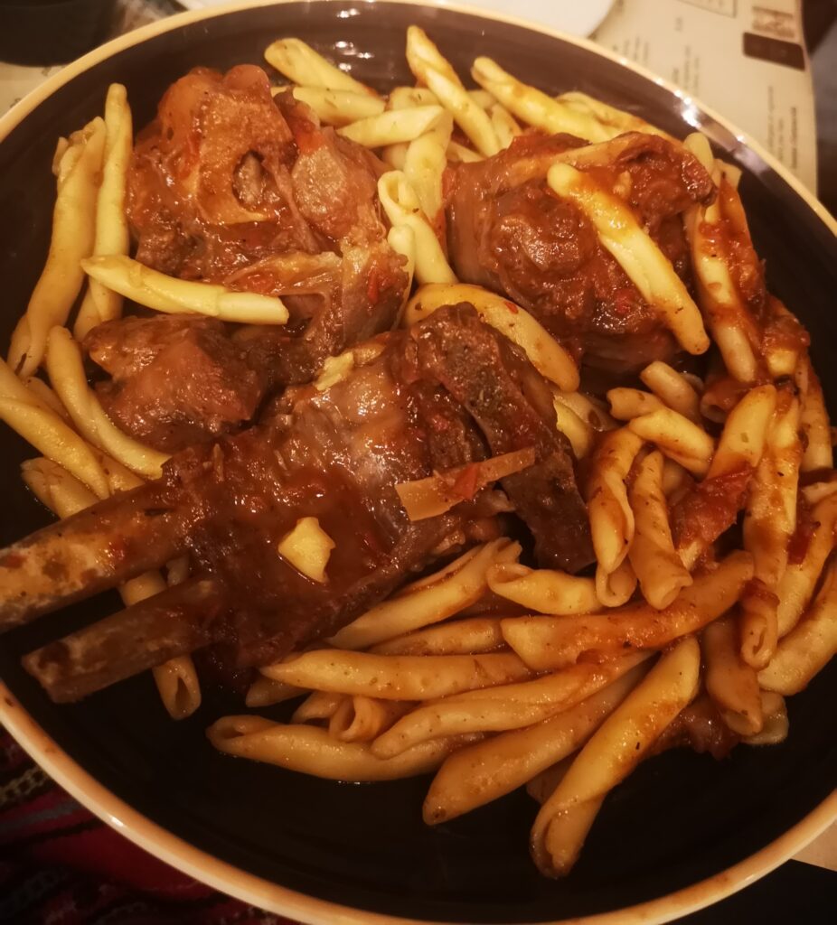 Local dish Roasted Goat with Cretan pasta