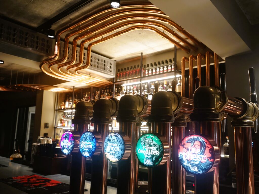 Five beer taps from the Uile Bheist local independent brewery