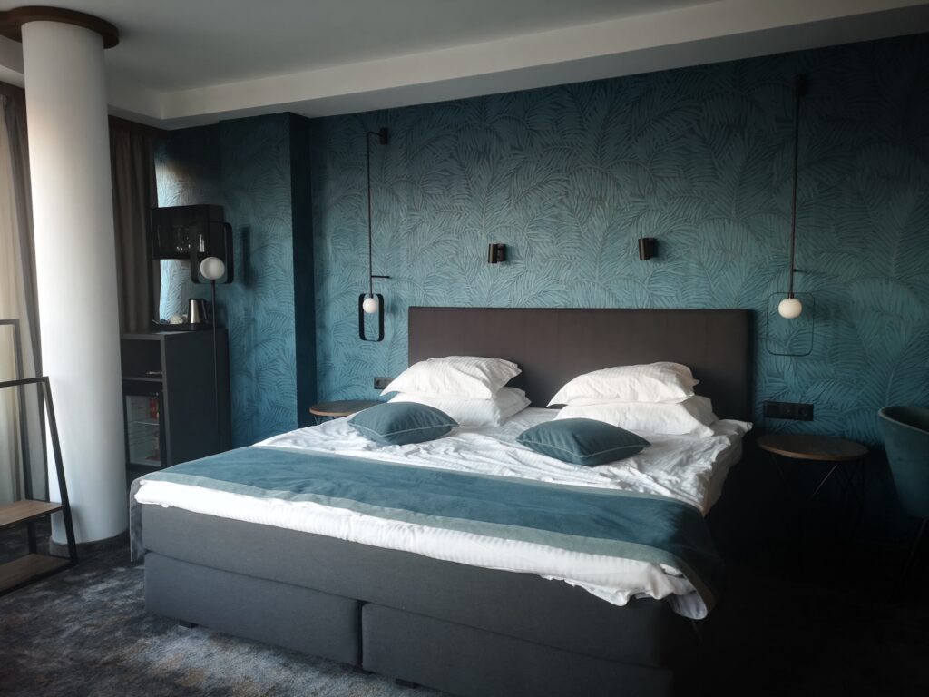 A King-sized bed in our luxurious panoramic hotel room.