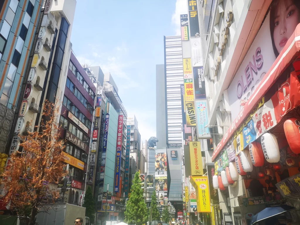 Arguably not a Top Tokyo Attraction, the head of giant reptile Godzilla and claw appearing over a tall building in Tokyo.